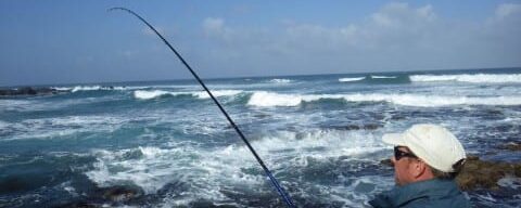 Spinning for kob in the surf